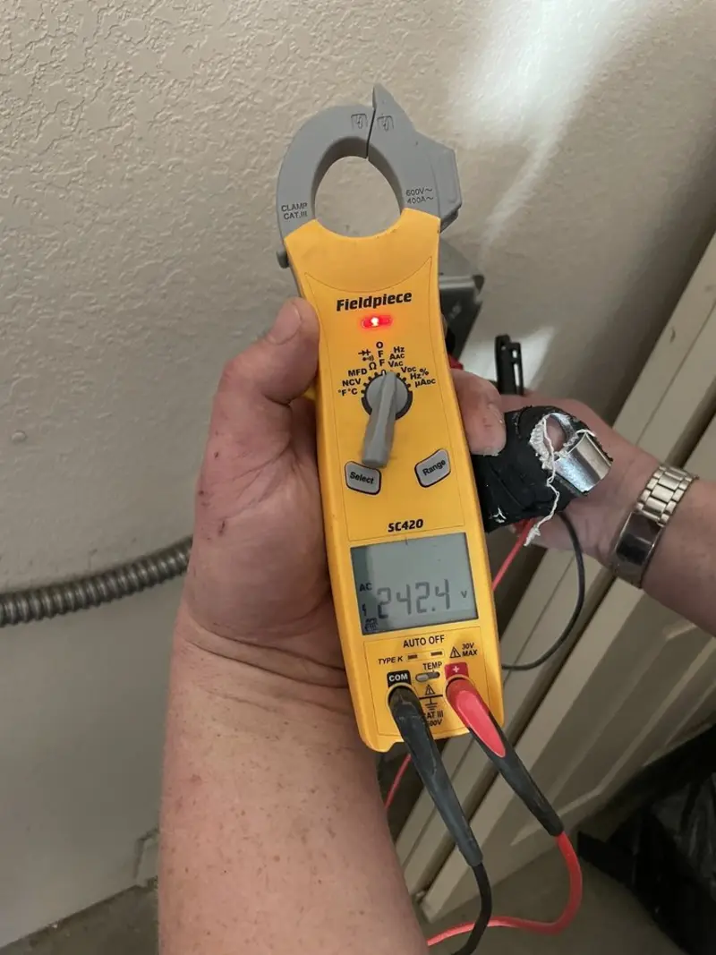 Voltage testing with clamp meter during Electrical Installation Services in Brooksville